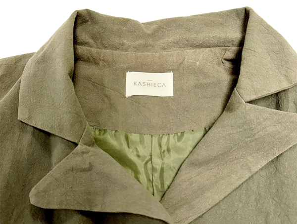 Close-up of Kashieca olive green casual dress for women, showcasing collar and fabric texture.