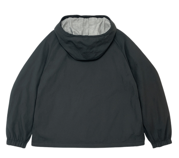 Black Uniqlo reversible sports jacket with hood, displayed flat showing the back and elastic cuffs.