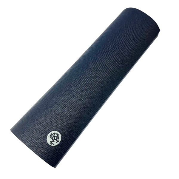 Black Manduka PROlite pilates mat rolled up, textured surface, with Manduka logo visible.