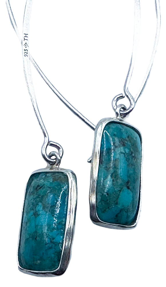 Silver drop earrings with rectangular turquoise stones, elegant jewelry accessory for women.