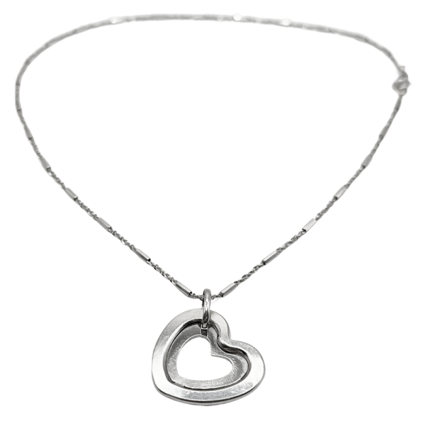 Gold pendant necklace featuring a delicate chain with an open heart-shaped pendant centerpiece.