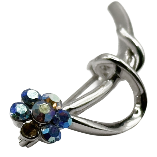 Silver floral crystal brooch pin with blue gemstones, elegant accessory for jackets and dresses.